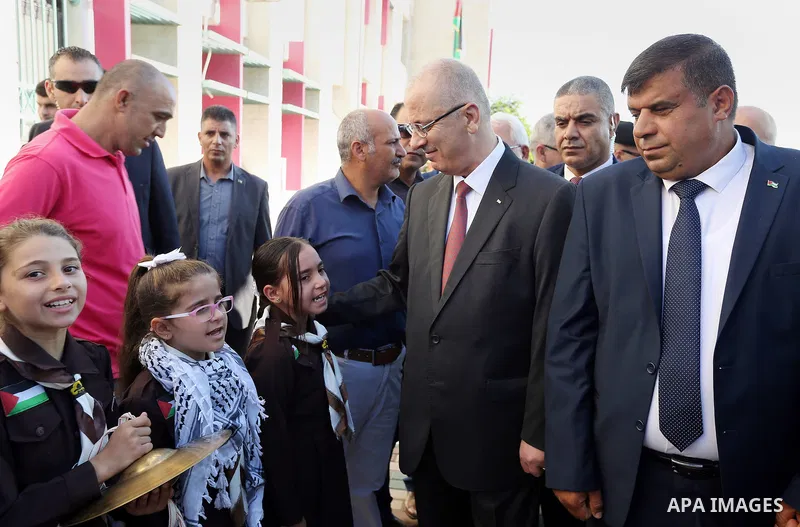 Palestinian Prime Minister Rami Hamdallah attends the opening of the new year study at Aqaba girl school, in the West Bank city of Tubas on August 29, 2018. Photo by Prime Minister Office