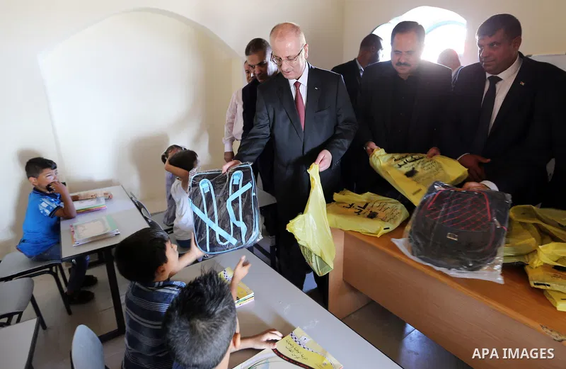Palestinian Prime Minister Rami Hamdallah attends the opening of the new year study at Aqaba girl school, in the West Bank city of Tubas on August 29, 2018. Photo by Prime Minister Office