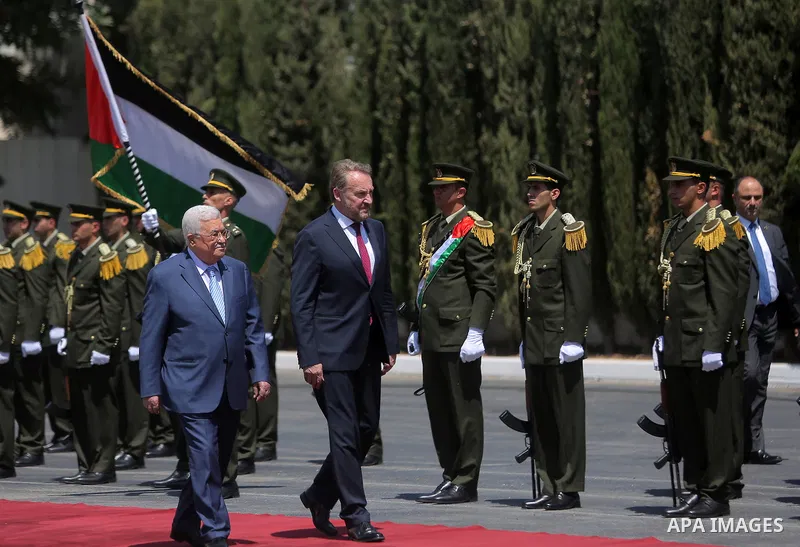 Palestinian President Mahmoud Abbas and Chairman of the Tripartite Presidency of Bosnia and Herzegovina Bakir Izetbegovic review the honor guard during a reception ceremony, in the West Bank city of Ramallah on August 29...