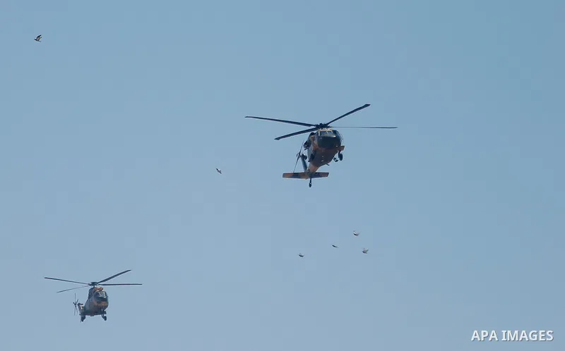A military helicopter carried Chairman of the Tripartite Presidency of Bosnia and Herzegovina Bakir Izetbegovic is seen on the sky of the West Bank city of Ramallah, before his meeting with Palestinian President Mahmoud...