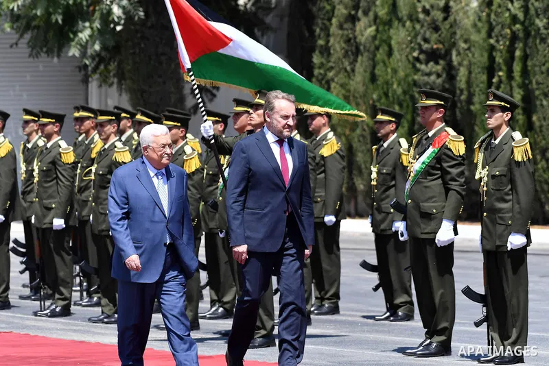 Palestinian President Mahmoud Abbas and Chairman of the Tripartite Presidency of Bosnia and Herzegovina Bakir Izetbegovic review the honor guard during a reception ceremony, in the West Bank city of Ramallah on August 29...
