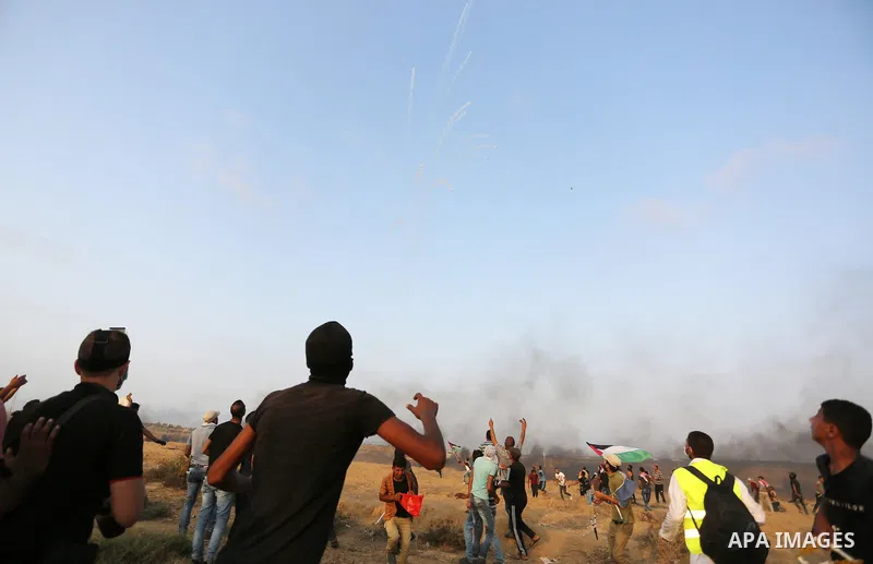 Palestinian protesters gather during clashes with Israeli troops in tents protest where Palestinians demand the right to return to their homeland at the Israel-Gaza border, in Khan Younis in the southern of Gaza Strip on...