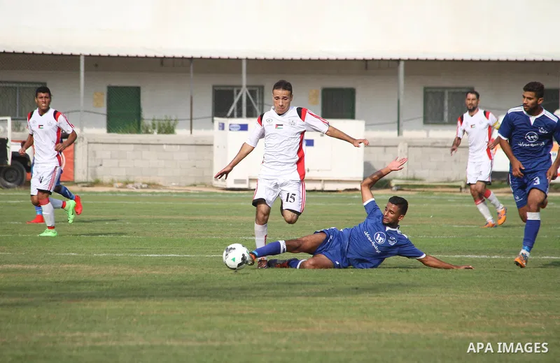 Palestinian Shabab Khan Younis players and Shabab Rafah players compete during Super Cup soccer match, at Palestine Stadium, in Gaza City on September 1, 2018. Photo by Mahmoud Ajour