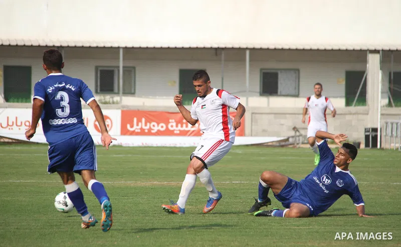Palestinian Shabab Khan Younis players and Shabab Rafah players compete during Super Cup soccer match, at Palestine Stadium, in Gaza City on September 1, 2018. Photo by Mahmoud Ajour