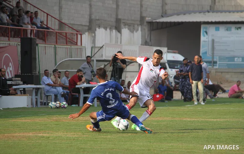 Palestinian Shabab Khan Younis players and Shabab Rafah players compete during Super Cup soccer match, at Palestine Stadium, in Gaza City on September 1, 2018. Photo by Mahmoud Ajour