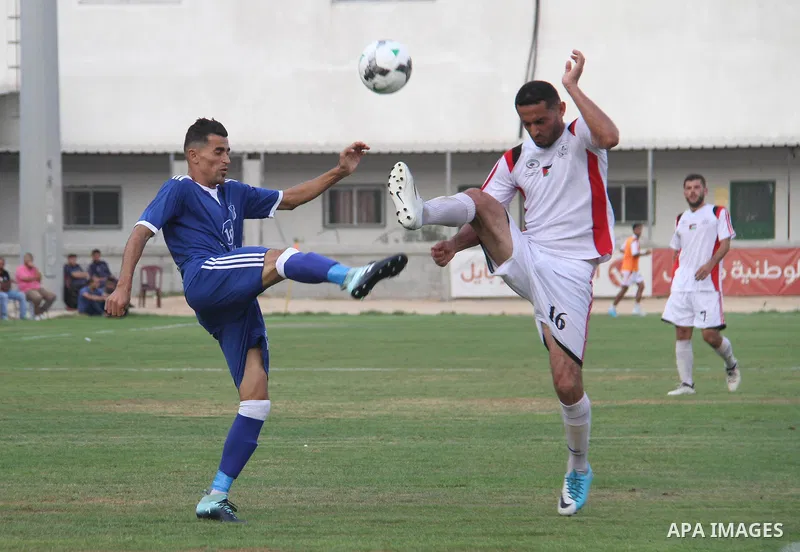 Palestinian Shabab Khan Younis players and Shabab Rafah players compete during Super Cup soccer match, at Palestine Stadium, in Gaza City on September 1, 2018. Photo by Mahmoud Ajour