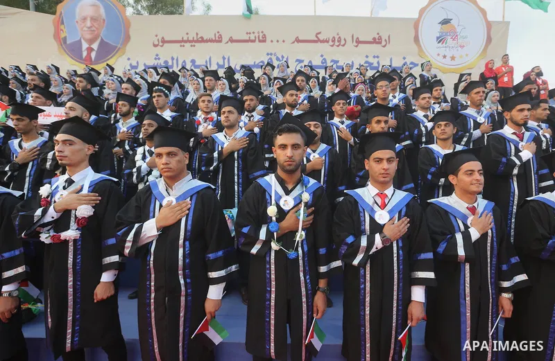 Palestinian students celebrate during their graduation ceremony at al-Aqsa University in Khan Younis in the southern of Gaza strip on Sep. 01, 2018. Photo by Atia Darwish