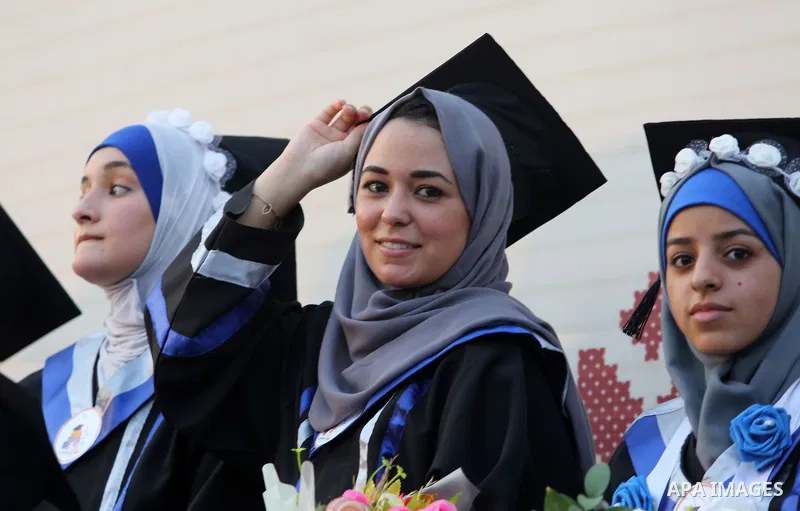 Palestinian students celebrate during their graduation ceremony at al-Aqsa University in Khan Younis in the southern of Gaza strip on Sep. 01, 2018. Photo by Atia Darwish