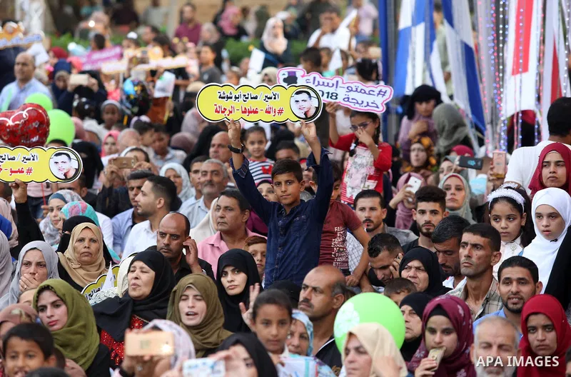 Palestinian students celebrate during their graduation ceremony at al-Aqsa University in Khan Younis in the southern of Gaza strip on Sep. 01, 2018. Photo by Atia Darwish