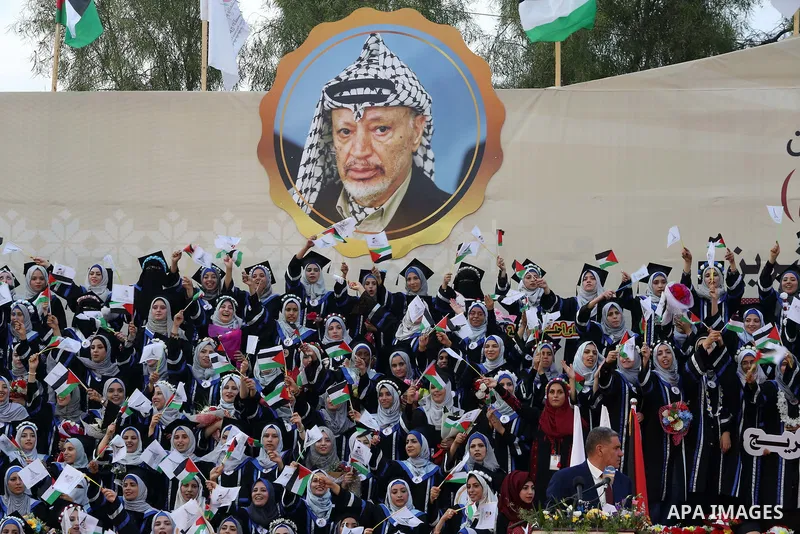 Palestinian students celebrate during their graduation ceremony at al-Aqsa University in Khan Younis in the southern of Gaza strip on Sep. 01, 2018. Photo by Atia Darwish