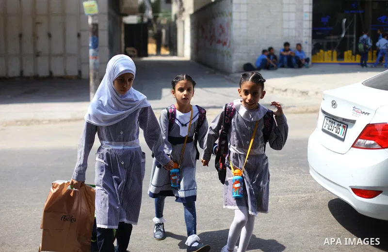 Palestinian students of United Nations-run schools walk in a street in Gaza city on September 2, 2018. The United States on Friday halted all funding to United Nations' agency that helps Palestinian refugees. State Depar...