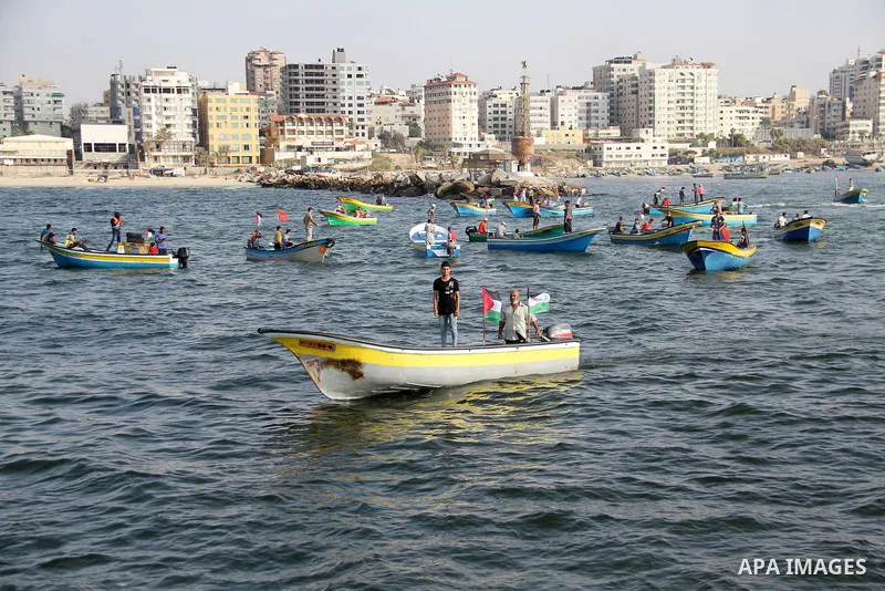Palestinians ride fishing boats during a rally to break Israel's blockade on Gaza Strip, at the sea in Gaza City, on September 2, 2018. Photo by Mahmoud Ajour