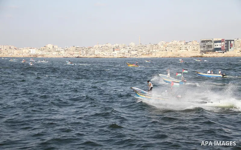 Palestinians ride fishing boats during a rally to break Israel's blockade on Gaza Strip, at the sea in Gaza City, on September 2, 2018. Photo by Mahmoud Ajour
