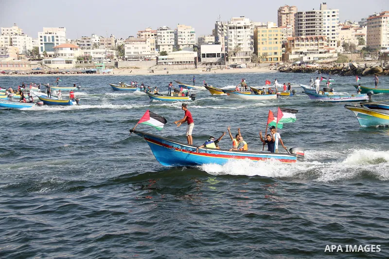 Palestinians ride fishing boats during a rally to break Israel's blockade on Gaza Strip, at the sea in Gaza City, on September 2, 2018. Photo by Mahmoud Ajour