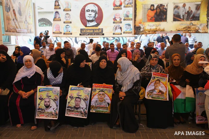 Palestinians take part in a protest to show solidarity with Palestinian prisoners held in Israeli jails, in front of Red cross office in Gaza city on Sept. 03, 2018. Photo by Mahmoud Ajour