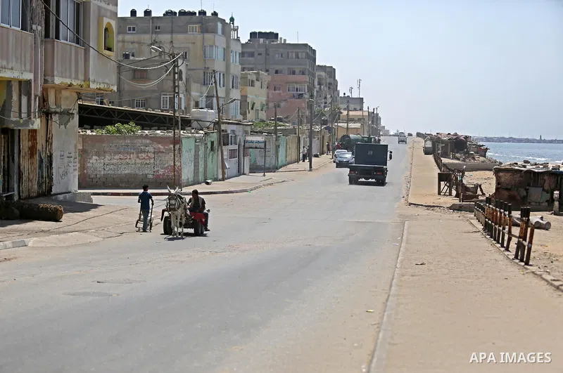 Palestinian refugees walk in a street at Al-Shati refugee camp, in Gaza City on September 3, 2018. The United States halted all funding to United Nations' agency that helps Palestinian refugees. State Department spokeswo...