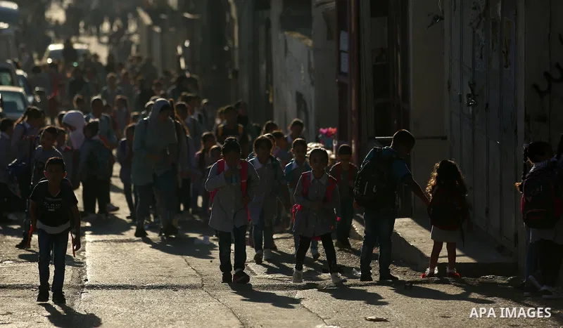 Palestinian students of United Nations-run schools walk in a street at Balata refugee camp near in the West Bank city of Nablus on September 4, 2018. The United States halted all funding to United Nations' agency that he...