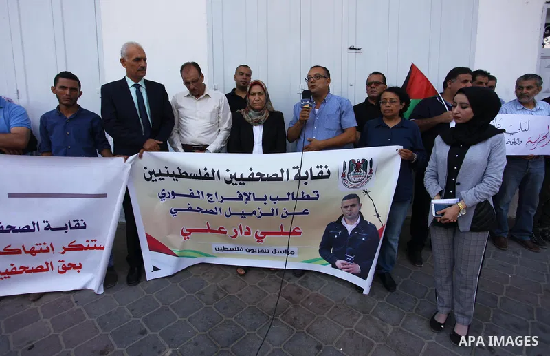 Palestinians take part during a protest demanding the release of Palestinian journalist Ali Dar Ali who was held in Israeli jails, in Gaza City on September 4, 2018. Photo by Mahmoud Ajour
