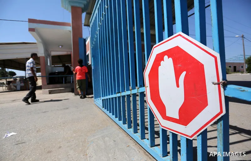 Palestinians stand outside the gate of Erez crossing with Israel in Beit Hanoun in the northern Gaza Strip on September 5, 2018. Israel closed on Wednesday Erez crossing with the Gaza Strip after a demonstration organize...