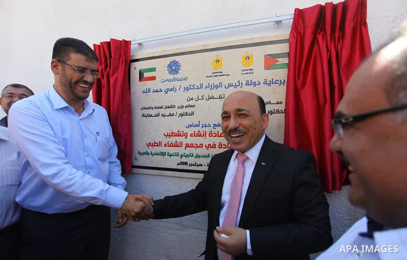 Palestinian Minister of public works and housing, Mufid al-Hasayna attends the laying ceremony of the foundation stone for the maternity hospital at Al-Shifa Medical Complex, in Gaza city, on Sept. 06, 2018. Photo by Mah...