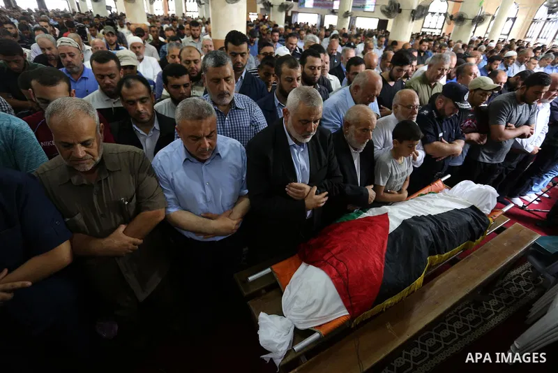 Palestinian Hamas Chief Ismail Haniyeh prays over the body of Palestinian Hamas militant Abdul Rahim Abbas ,42, who was killed in an unexplained explosion, during his funeral, in Gaza city, on Sept. 06, 2018. Photo by As...