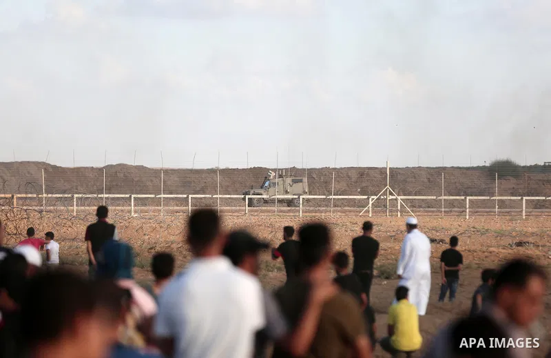 Palestinian protesters gather during clashes with Israeli troops in tents protest where Palestinians demand the right to return to their homeland at the Israel-Gaza border, in east of Gaza city on September 7, 2018. Phot...