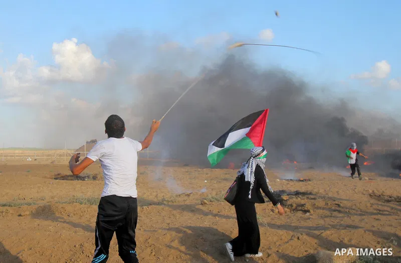 Palestinian protesters gather during clashes with Israeli troops in tents protest where Palestinians demand the right to return to their homeland at the Israel-Gaza border, in east of Gaza city on September 7, 2018. Phot...