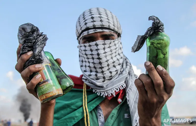 Palestinian protesters gather during clashes with Israeli troops in tents protest where Palestinians demand the right to return to their homeland at the Israel-Gaza border, in east of Gaza city on September 7, 2018. Phot...