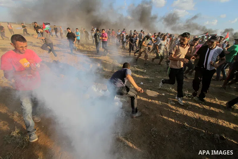 Palestinian protesters gather during clashes with Israeli troops in tents protest where Palestinians demand the right to return to their homeland at the Israel-Gaza border, in east of Gaza city on September 7, 2018. Phot...
