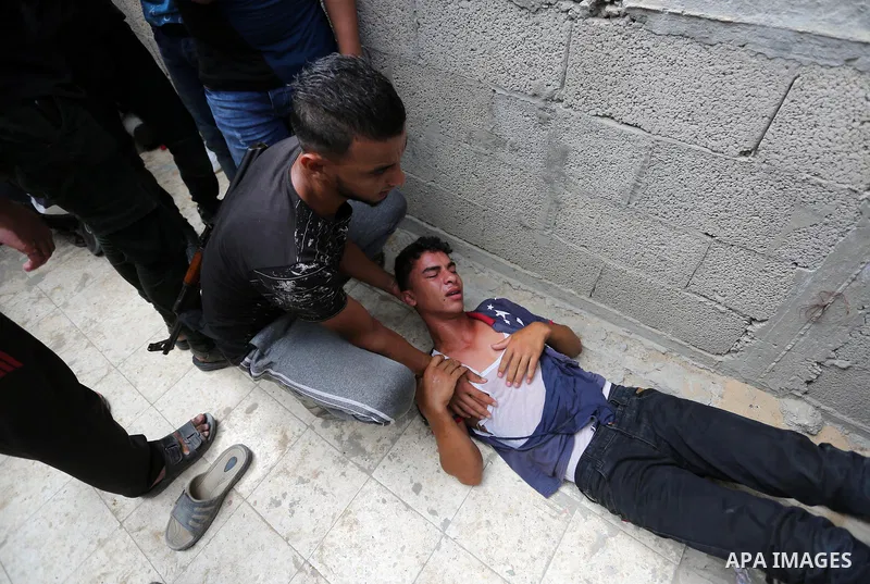 Relatives of Palestinian Belal Khafaja, 17, who was shot dead by Israeli troops during clashes in tents protest at the Israel-Gaza border, mourn during his funeral in Rafah in the southern Gaza Strip on September 8, 2018...