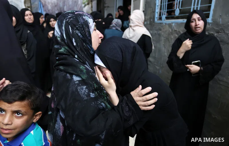 Relatives of Palestinian Belal Khafaja, 17, who was shot dead by Israeli troops during clashes in tents protest at the Israel-Gaza border, mourn during his funeral in Rafah in the southern Gaza Strip on September 8, 2018...