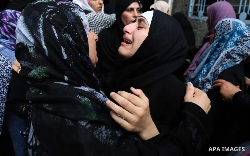 Relatives of Palestinian Belal Khafaja, 17, who was shot dead by Israeli troops during clashes in tents protest at the Israel-Gaza border, mourn during his funeral in Rafah in the southern Gaza Strip on September 8, 2018...