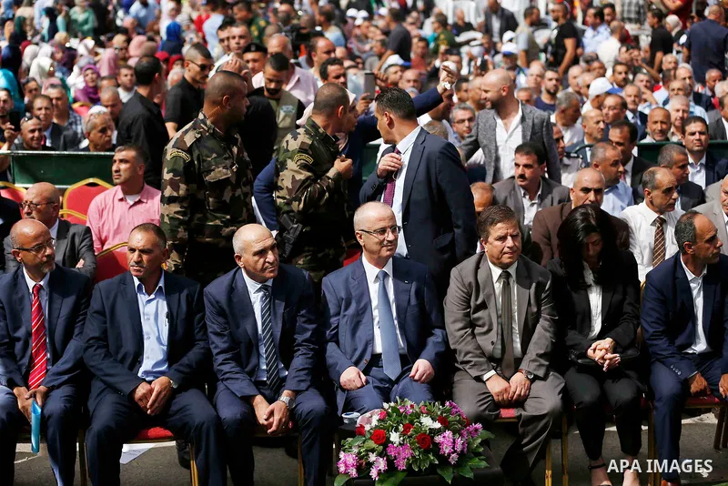 Palestinian Prime Minister Rami Hamdallah attends the Palestinian grapes festival in Halhoul village, near the West Bank city of Hebron, on September 10, 2018. Hebron is very famous in grape production as it contains man...