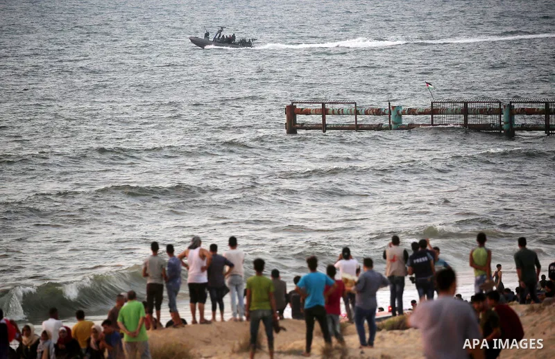 Palestinian protesters gather during a demonstration against the Israeli blockade on Gaza Strip, along the Gaza sea barrier on the maritime border with Israel near Kibbutz Zikim, north of Beit Lahia in the northern Gaza...