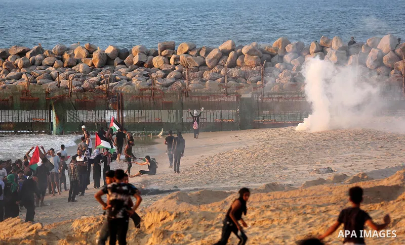 Palestinian protesters gather during a demonstration against the Israeli blockade on Gaza Strip, along the Gaza sea barrier on the maritime border with Israel near Kibbutz Zikim, north of Beit Lahia in the northern Gaza...