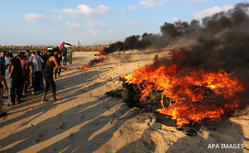 Palestinian protesters gather during a demonstration against the Israeli blockade on Gaza Strip, along the Gaza sea barrier on the maritime border with Israel near Kibbutz Zikim, north of Beit Lahia in the northern Gaza...