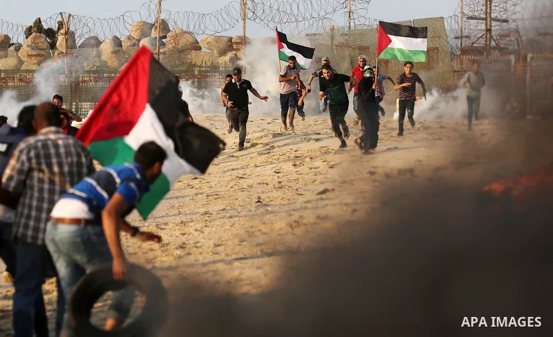 Palestinian protesters gather during a demonstration against the Israeli blockade on Gaza Strip, along the Gaza sea barrier on the maritime border with Israel near Kibbutz Zikim, north of Beit Lahia in the northern Gaza...