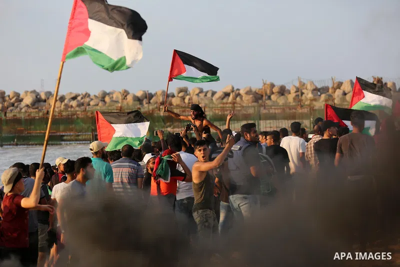 Palestinian protesters gather during a demonstration against the Israeli blockade on Gaza Strip, along the Gaza sea barrier on the maritime border with Israel near Kibbutz Zikim, north of Beit Lahia in the northern Gaza...