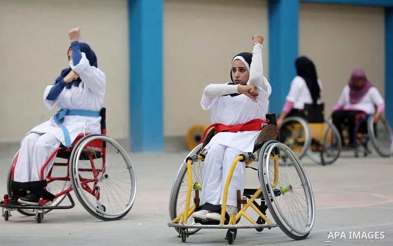 Palestinian handicappeds on wheelchairs take part in a Karate lesson, at a club in Gaza city on September 11, 2018. Photo by Ashraf Amra