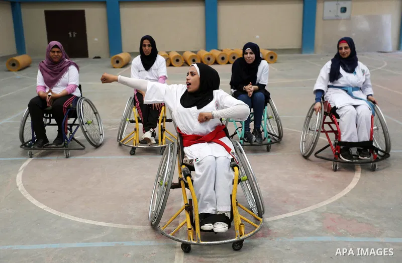 Palestinian handicappeds on wheelchairs take part in a Karate lesson, at a club in Gaza city on September 11, 2018. Photo by Ashraf Amra