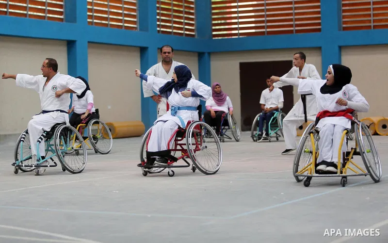 Palestinian handicappeds on wheelchairs take part in a Karate lesson, at a club in Gaza city on September 11, 2018. Photo by Ashraf Amra