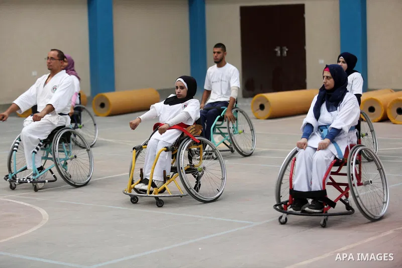 Palestinian handicappeds on wheelchairs take part in a Karate lesson, at a club in Gaza city on September 11, 2018. Photo by Ashraf Amra