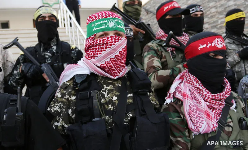 Members of various Palestinian armed factions take part in a press conference at the legislative council, on the occasion of the 25th anniversary of the Oslo accords, in Gaza city on September 12, 2018. The Oslo Accords...