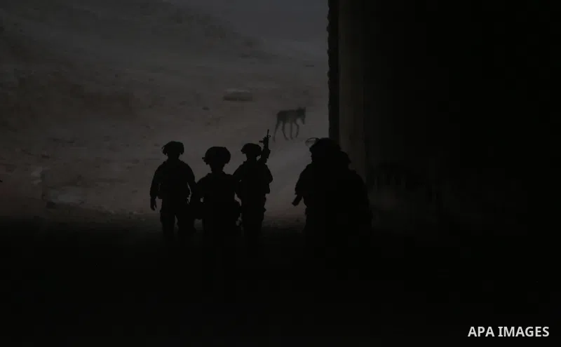 Israeli forces stand guard as the Israeli army remove shacks erected by Palestinian activists to protest against Israel's plan to demolish the Palestinian Bedouin village of Khan al-Ahmar, in Khan al-Ahmar, in the occupi...