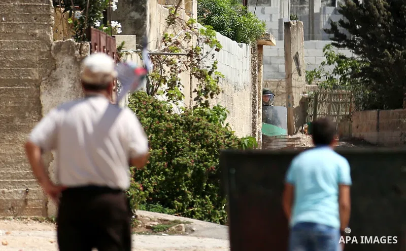 Israeli forces take position during clashes with Palestinian protesters following a weekly demonstration against the expropriation of Palestinian land by Israel in the village of Kfar Qaddum, near the West Bank city of N...
