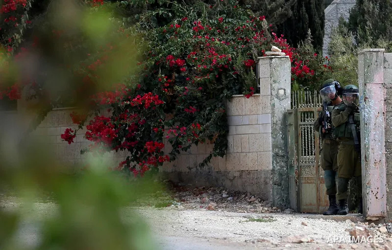 Israeli forces take position during clashes with Palestinian protesters following a weekly demonstration against the expropriation of Palestinian land by Israel in the village of Kfar Qaddum, near the West Bank city of N...