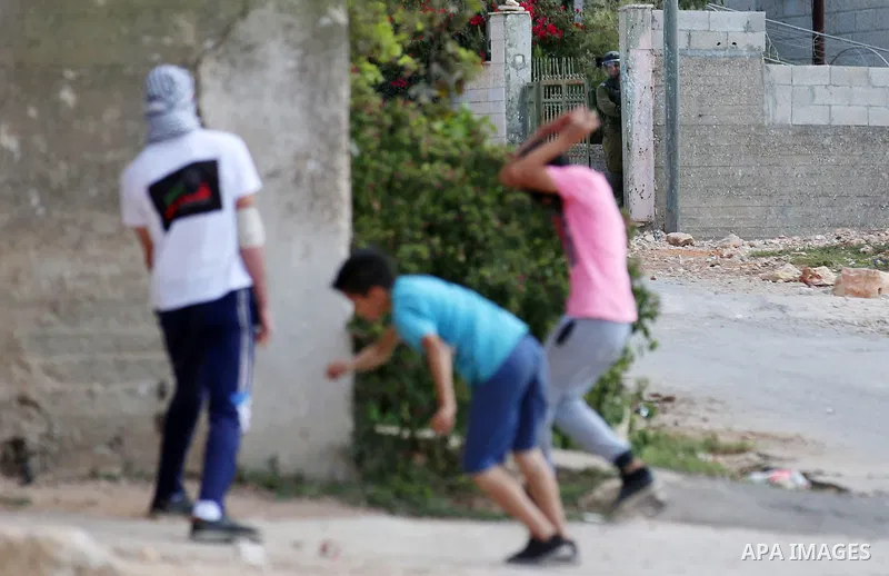 Israeli forces take position during clashes with Palestinian protesters following a weekly demonstration against the expropriation of Palestinian land by Israel in the village of Kfar Qaddum, near the West Bank city of N...