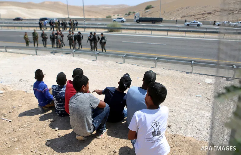 Israeli troops take position during a demonstration by Palestinian protesters against the blocking of the road leading to the Palestinian Bedouin village of Khan al-Ahmar in the occupied West Bank on September 14, 2018....