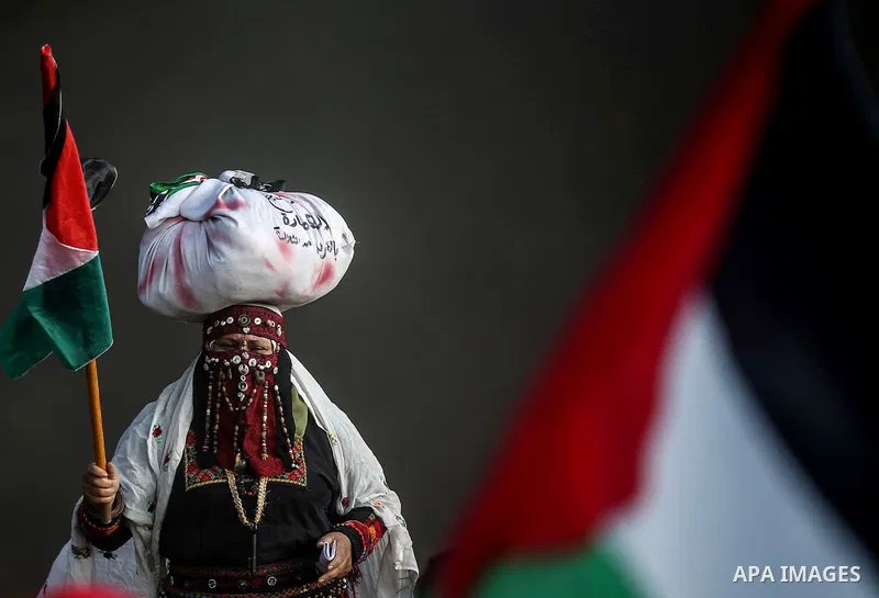 Palestinian protesters gather during clashes with Israeli troops in tents protest where Palestinians demand the right to return to their homeland at the Israel-Gaza border, in east of Gaza city on September 14, 2018. Pho...