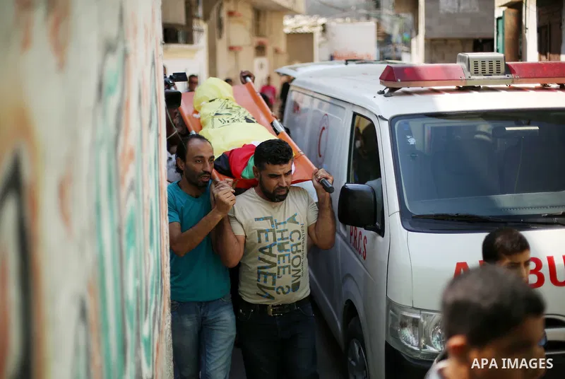 Mourners carry the body Palestinian boy Shady Abdel Aal, 11, who was shot dead by Israeli troops during clashes in tents protest at the Israel-Gaza border, during his funeral in Beit Lahia, in the northern of Gaza Strip...